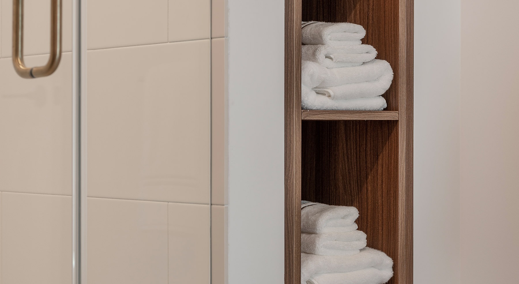 bathroom with large closet and two sinks