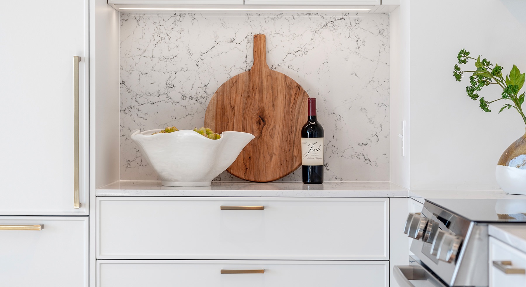 Spacious well lit living room with large floor to ceiling windows 