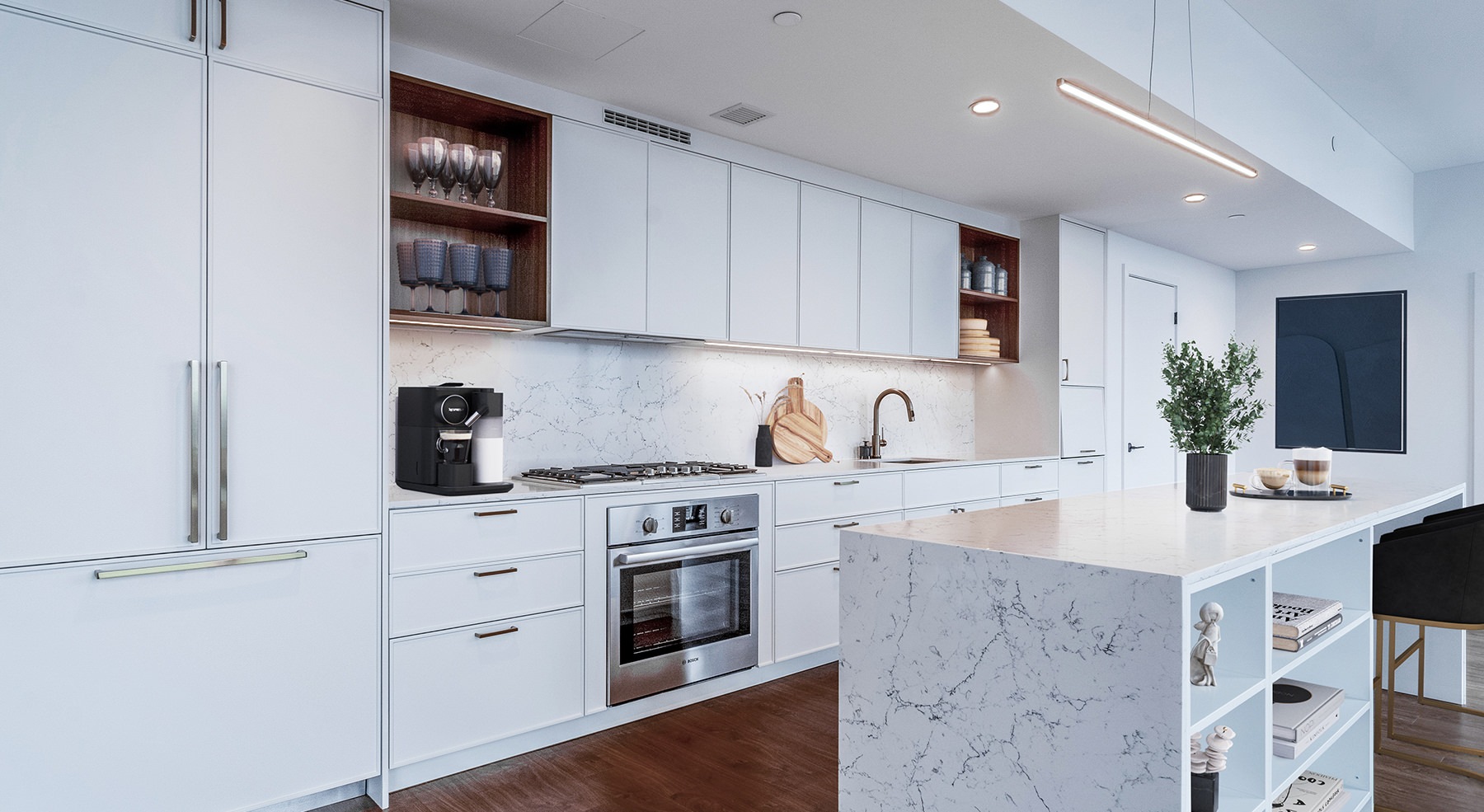 Spacious and well lit kitchen with wood floors and stainless steel appliances